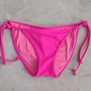 Pink Victoria's Secret swim bottoms.